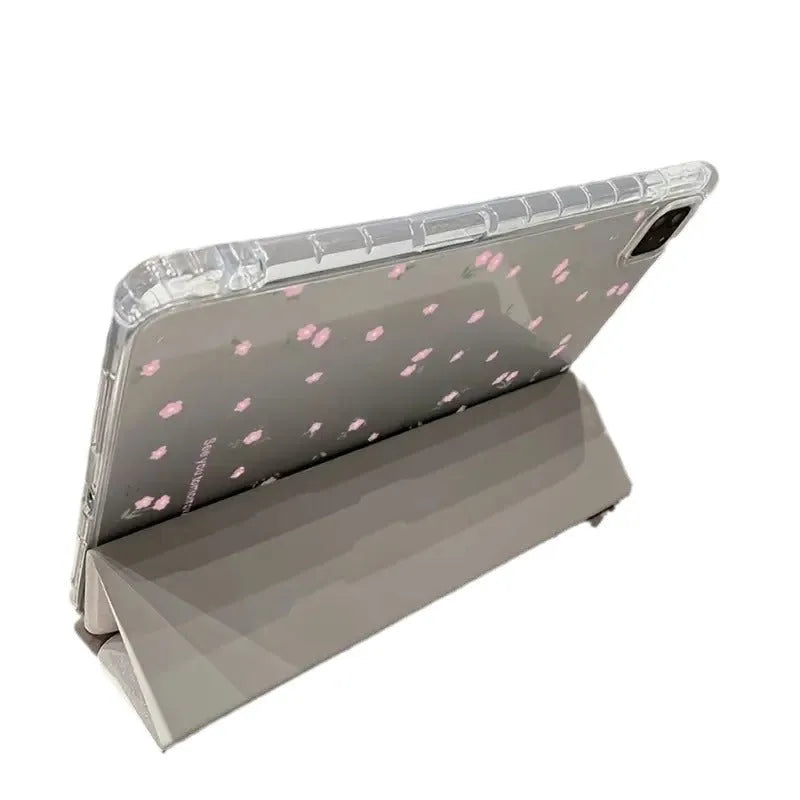 Transparent floral patterned tri-fold iPad case showing magnetic stand function