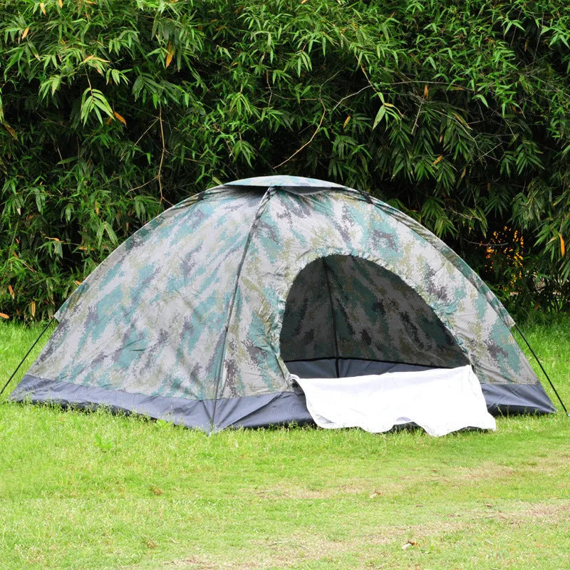 Green camouflage dome tent with mesh windows and steel ground nails setup outdoors