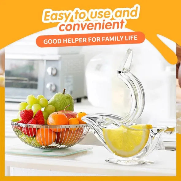Transparent acrylic manual lemon juicer with bird-shaped design on a kitchen counter
