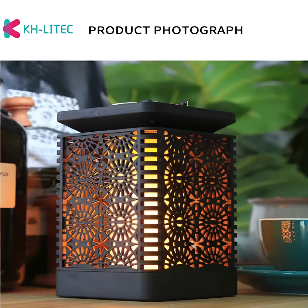 Four black solar-powered hanging lanterns with flame effect LED for garden decoration