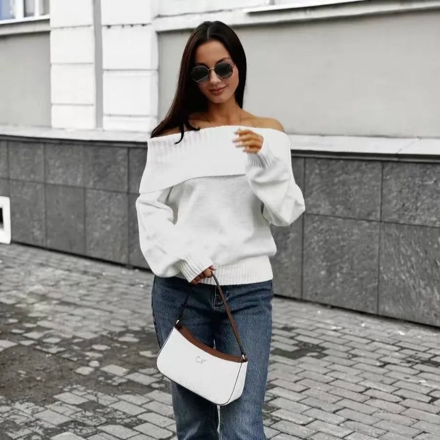 Grey off-the-shoulder women's sweater with a 3D pattern and regular sleeves on a hanger.