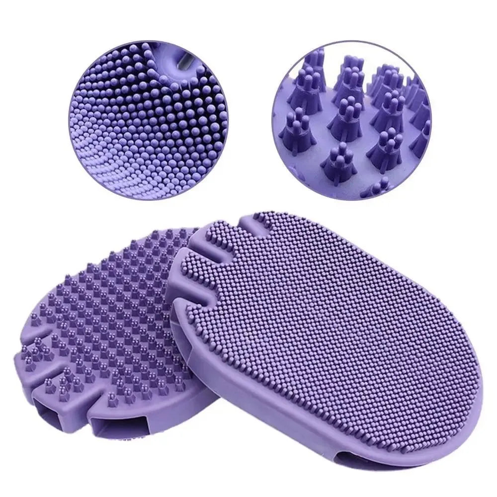 Purple dual-sided pet shampoo and massage brush with soft TPR bristles and ergonomic handle.