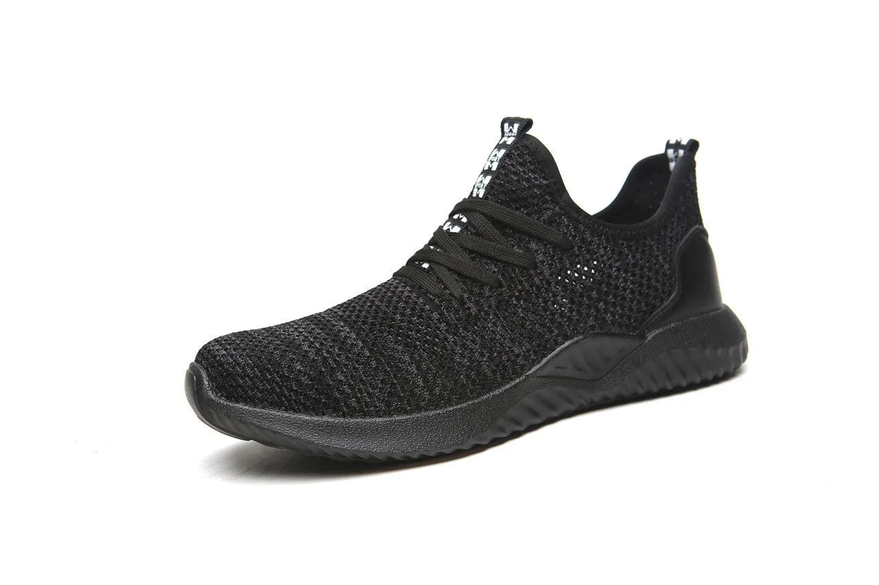 Low-cut black safety shoes with a steel toe cap on a plain background.