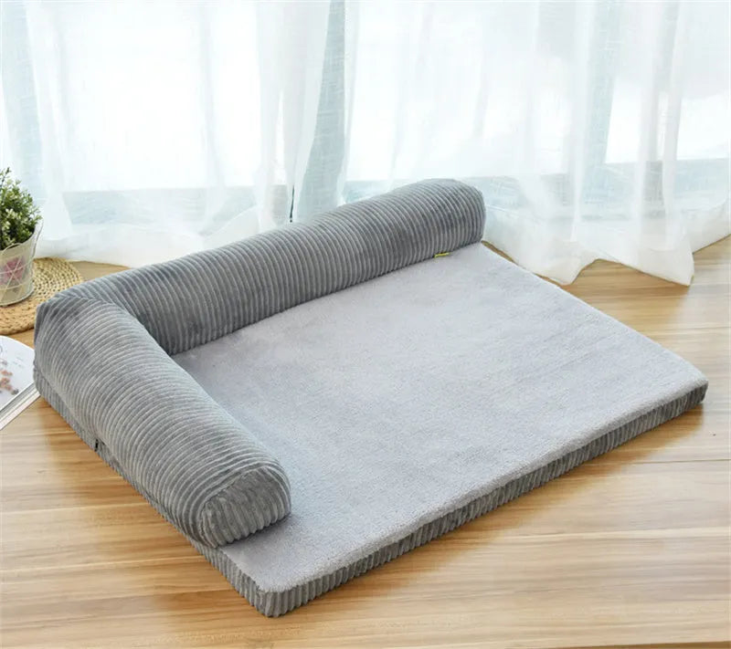 Corduroy bolster dog bed in grey colour with a non-slip base, shown in a large size for big dogs.