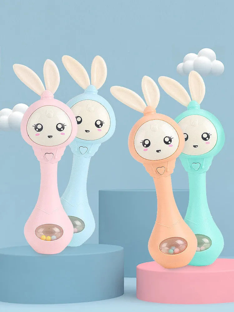 Baby holding colourful musical teething stick toy with light blue ABS plastic construction