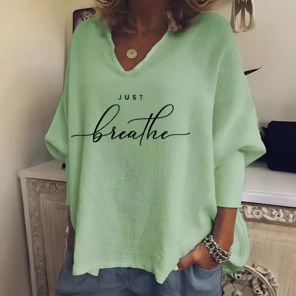 Women's loose fit V-neck long sleeve top in brushed milk silk fabric with digital print design.
