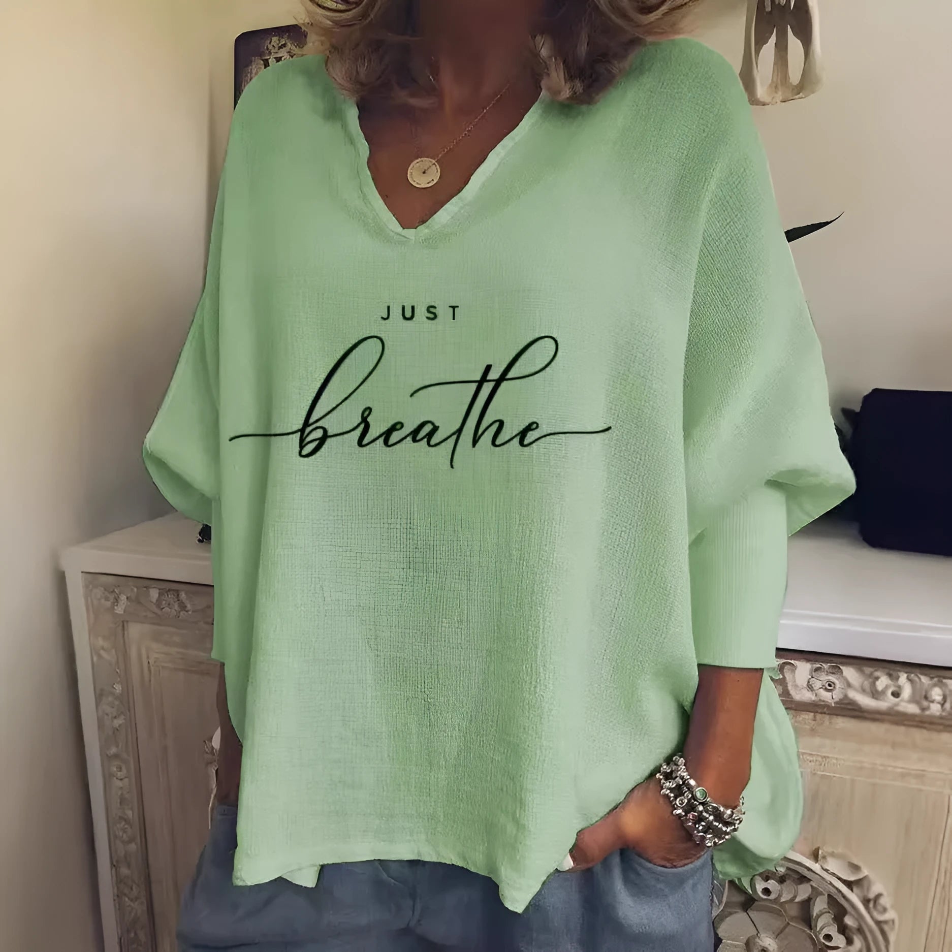 Women's loose fit V-neck long sleeve top in brushed milk silk fabric with digital print design.