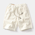 Men's khaki cargo shorts with straight leg cut and American retro street style