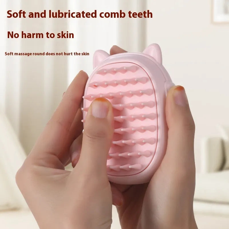Pink and yellow pet grooming comb with integrated laser toy for cats and dogs