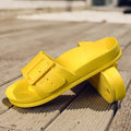 Women's grey blue EVA buckle slippers showing adjustable strap and soft sole.