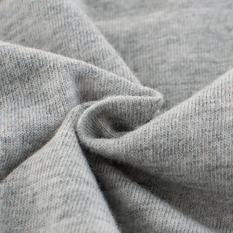 Grey children's cotton T-shirt laid flat, showing a size chart for measurements from 90cm to 140cm.