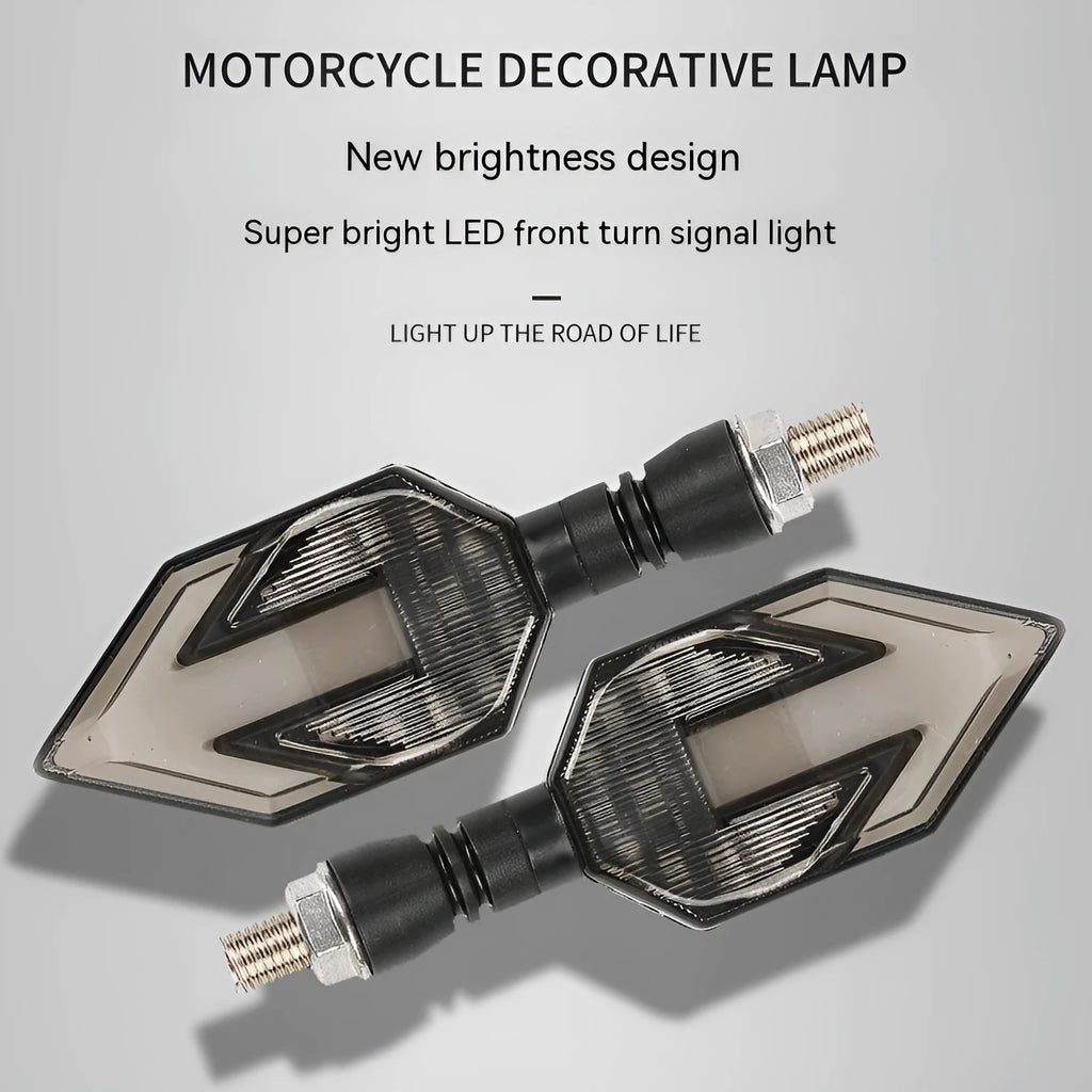Arrow-shaped LED motorcycle direction indicator light with 12V yellow and coloured accent options.