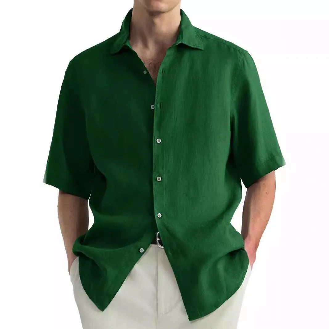 Men's green washed cotton casual shirt with a cardigan style on a hanger.