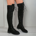 Women's black lace-up over-the-knee boots with a flat rubber sole and stitching detail.