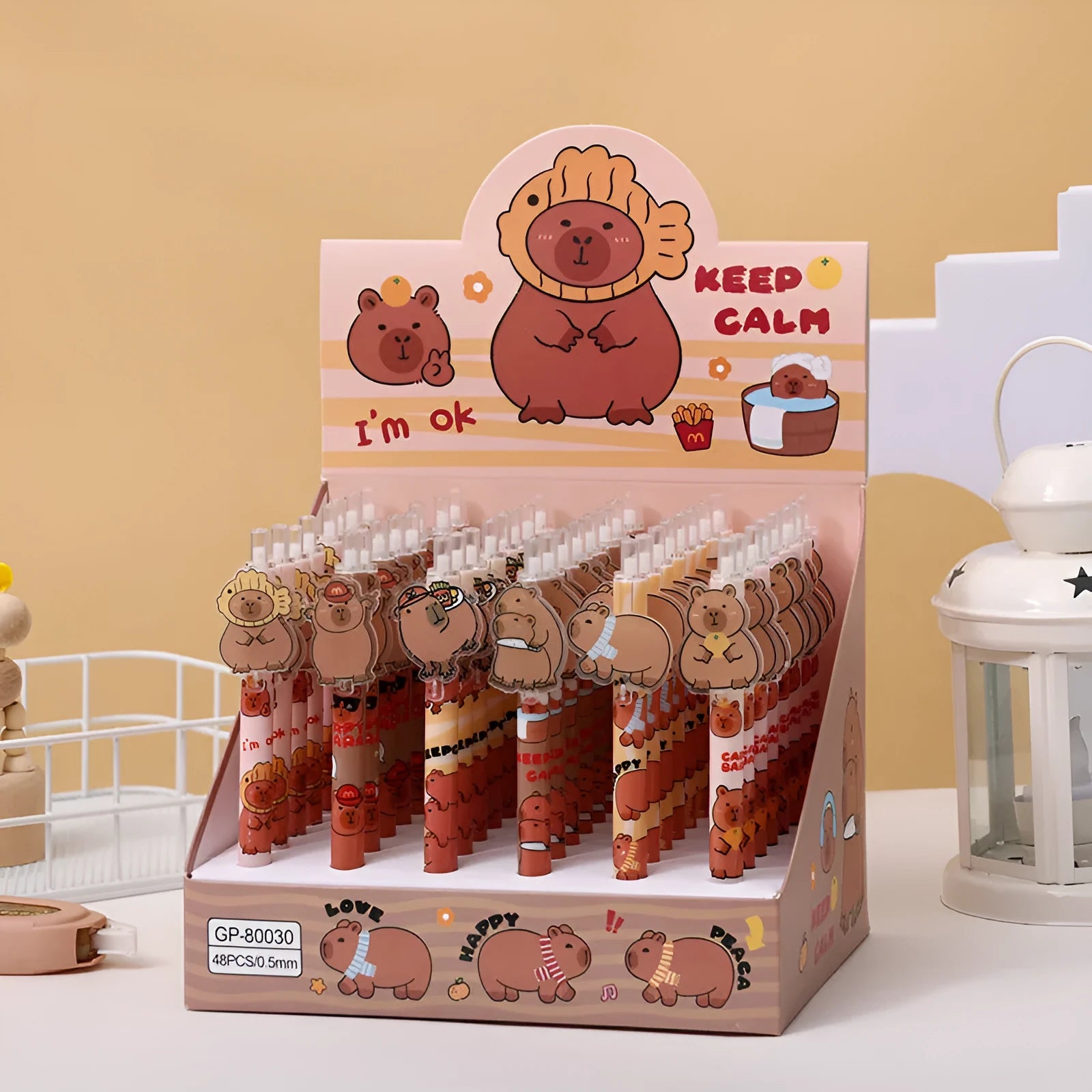Box of 48 cartoon bear gel pens with black ink and plastic shells.