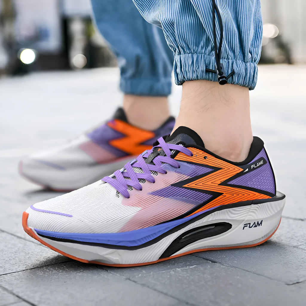 Marathon carbon plate racing shoes in orange colour with fabric upper and platform heel design for running