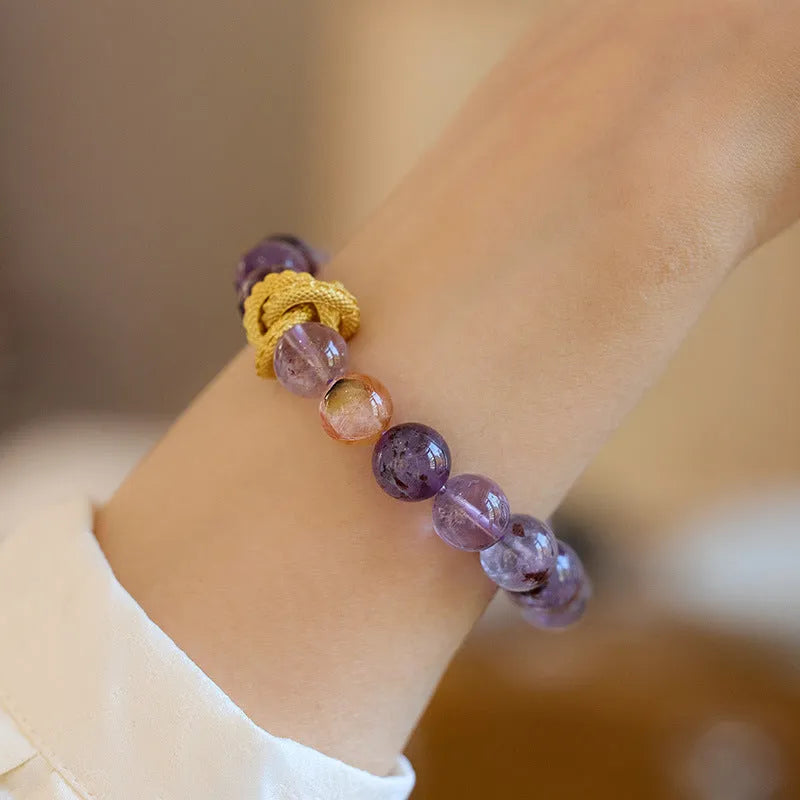 Purple crystal bracelet with animal zodiac beads and nine purple good luck elements