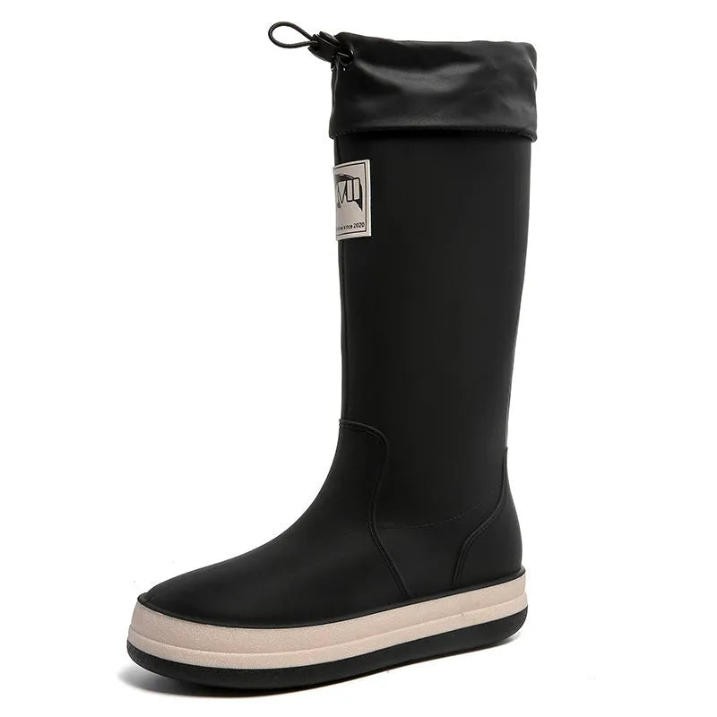 Pair of solid colour platform heel PVC wellington boots for men and women.
