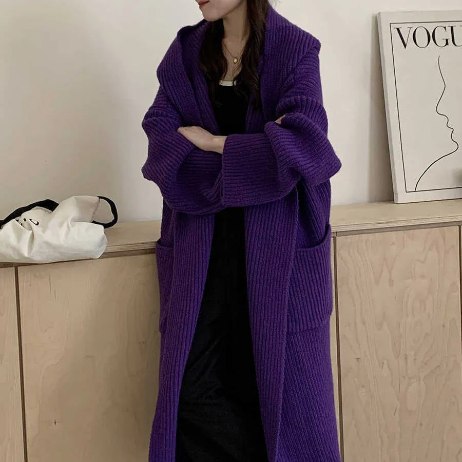 Women's loose grey hooded acrylic cardigan coat with long sleeves, shown open.