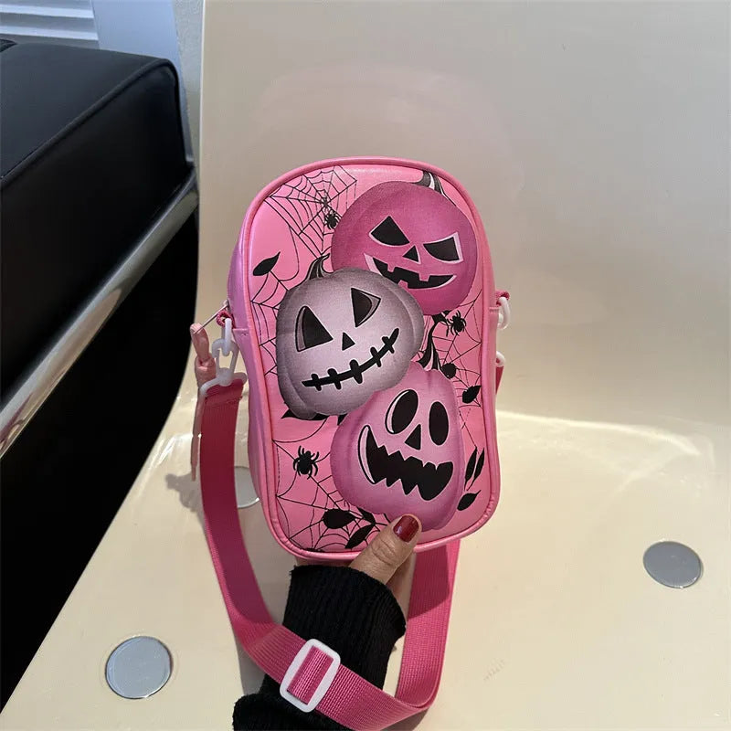 Black Halloween-themed mini crossbody bag with cartoon pumpkin, ghost, and bat prints.