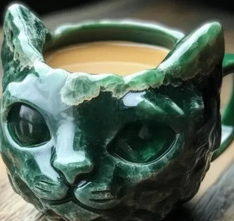Pastel coloured resin geode mug with an embedded crystal-style cat figurine.