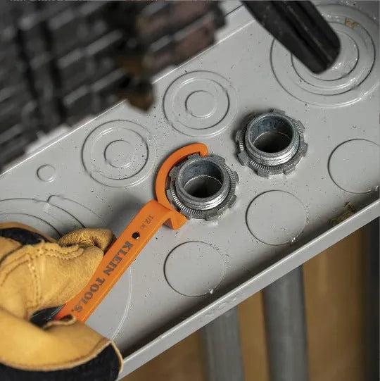 Three-piece spanner set showing orange, grey, and black wrenches with magnetic suction and catheter locking functions