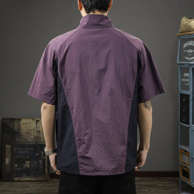 Brown men's half-zip stand collar short-sleeve shirt on a hanger, showing loose fit and ice silk fabric texture.