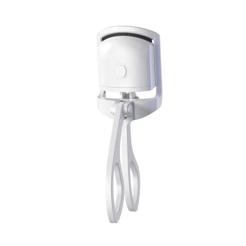 White USB rechargeable heated eyelash curler with dual temperature lights, shown next to its charging cable.