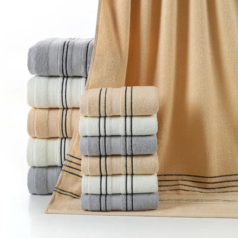 Pure cotton bath towel set showing large bath towel and two matching hand towels in available colours