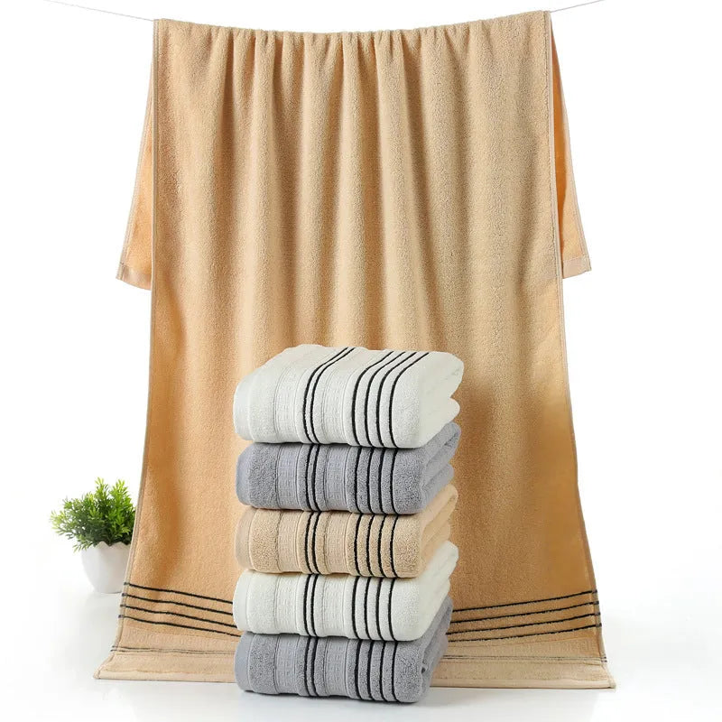 Pure cotton bath towel set showing large bath towel and two matching hand towels in available colours