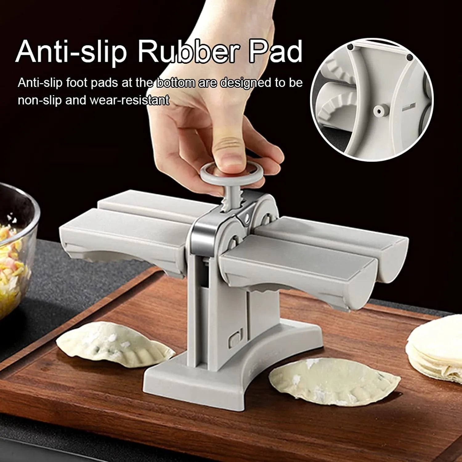 White double-head manual dumpling mould with stainless steel and plastic construction on a rubber anti-slip mat.