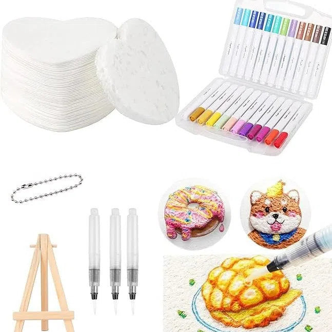 DIY brush set with foam grained paper, 12 marker pens, three fountain pens, beads, chain, and mini easel on a table