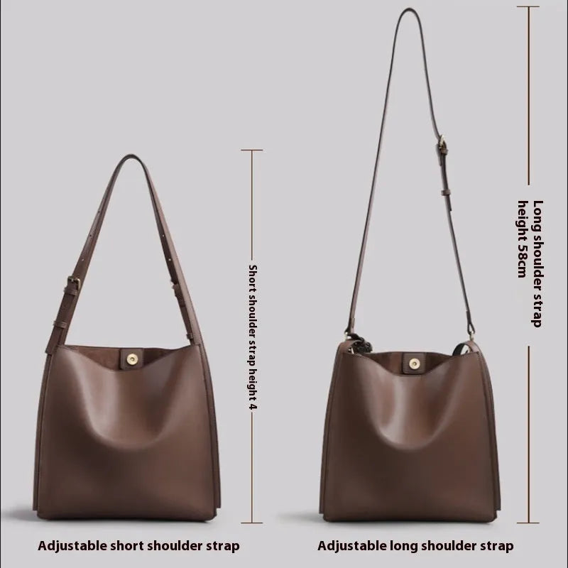 Brown genuine leather women's bucket bag with double shoulder straps and multiple internal organisers