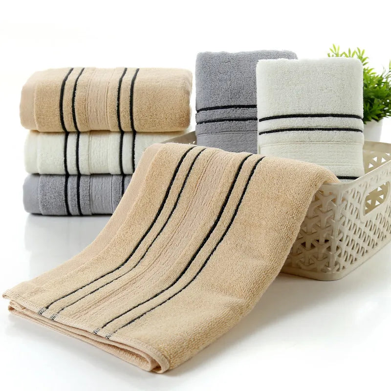 Pure cotton bath towel set showing large bath towel and two matching hand towels in available colours