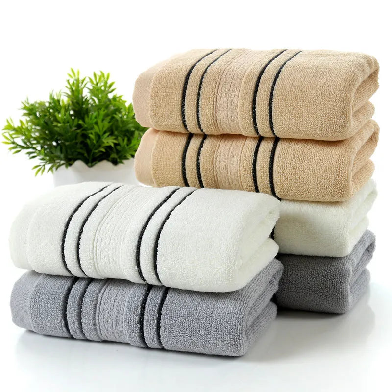 Pure cotton bath towel set showing large bath towel and two matching hand towels in available colours