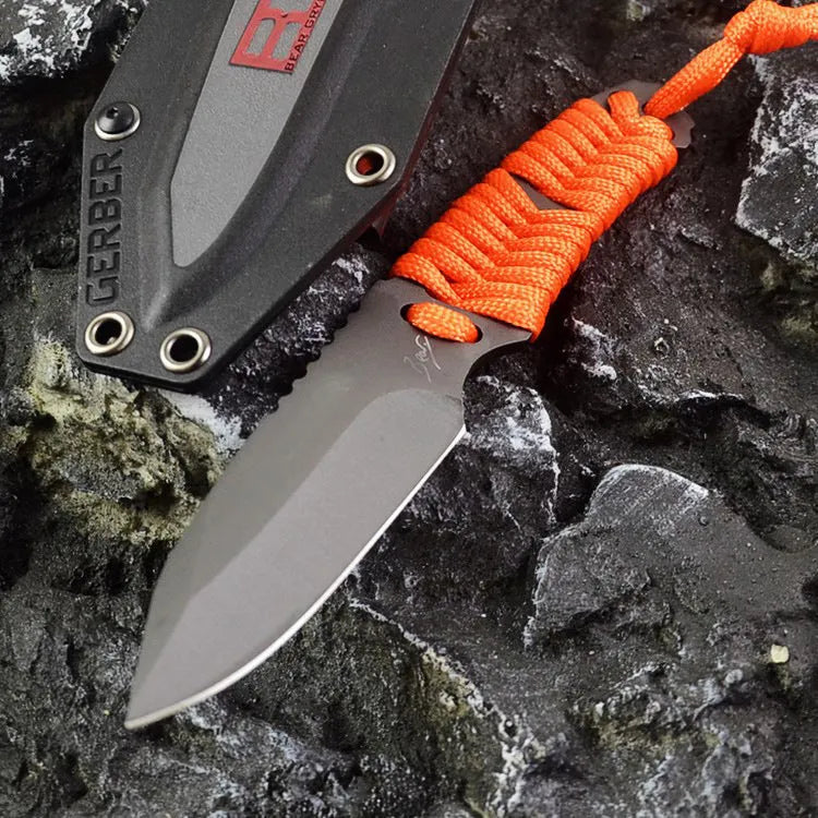 Camping knife with straight blade and rope bound handle showing ABS sheath