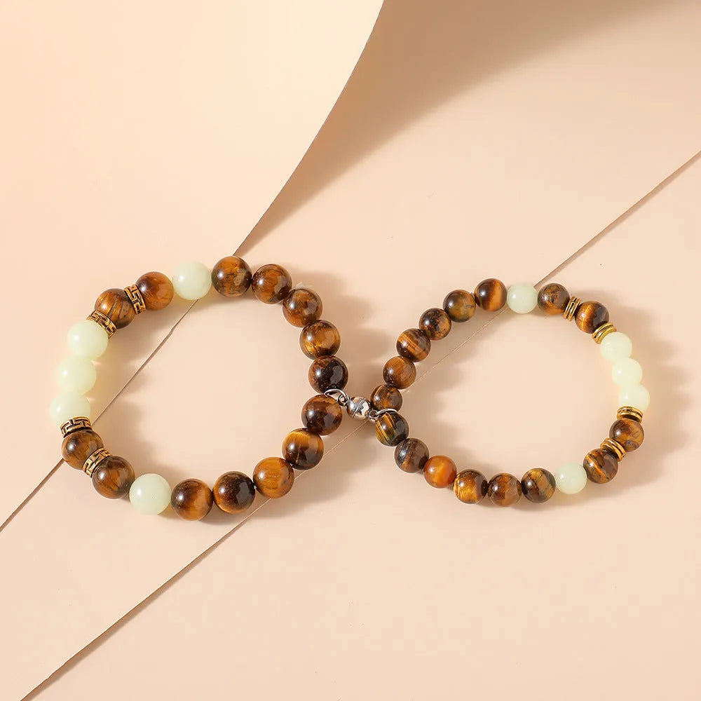 Geometric couple bracelets in luminous amber colour with retro fashion styling
