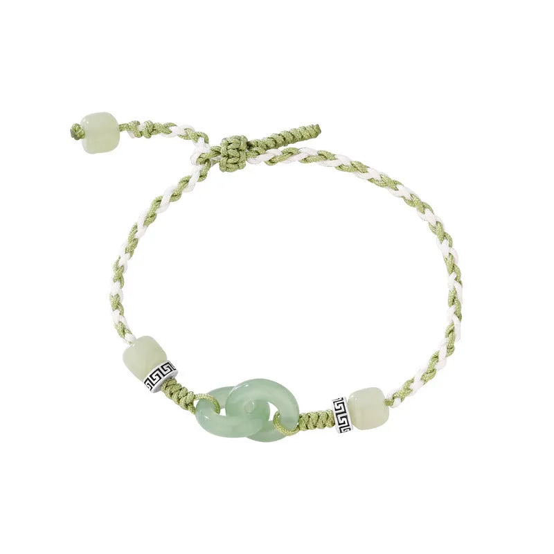 Women's copper bracelet with jade peace buckle and ethnic woven double-ring strap.