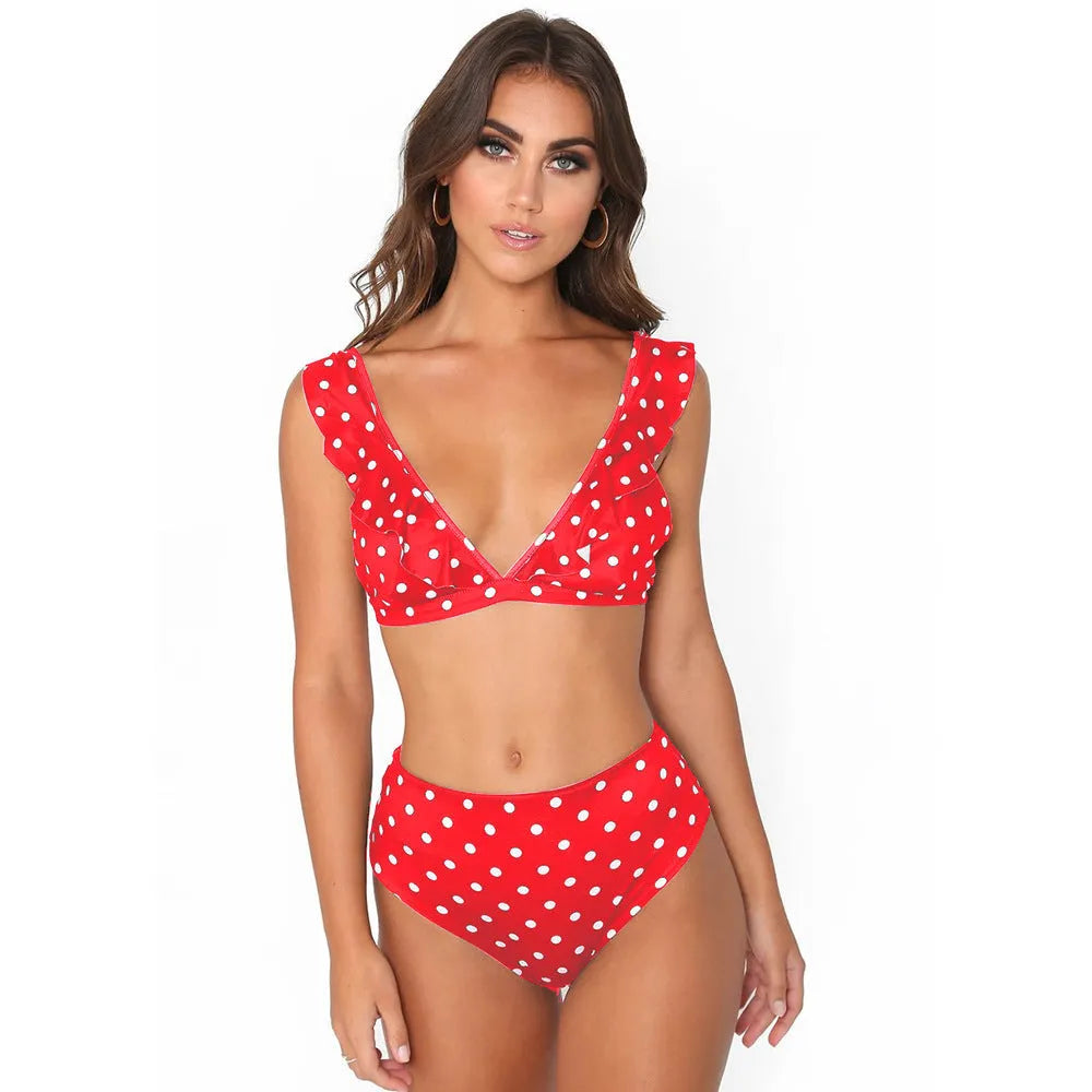Black and white polka dot print bikini set with deep V-neck ruffled top and matching shorts