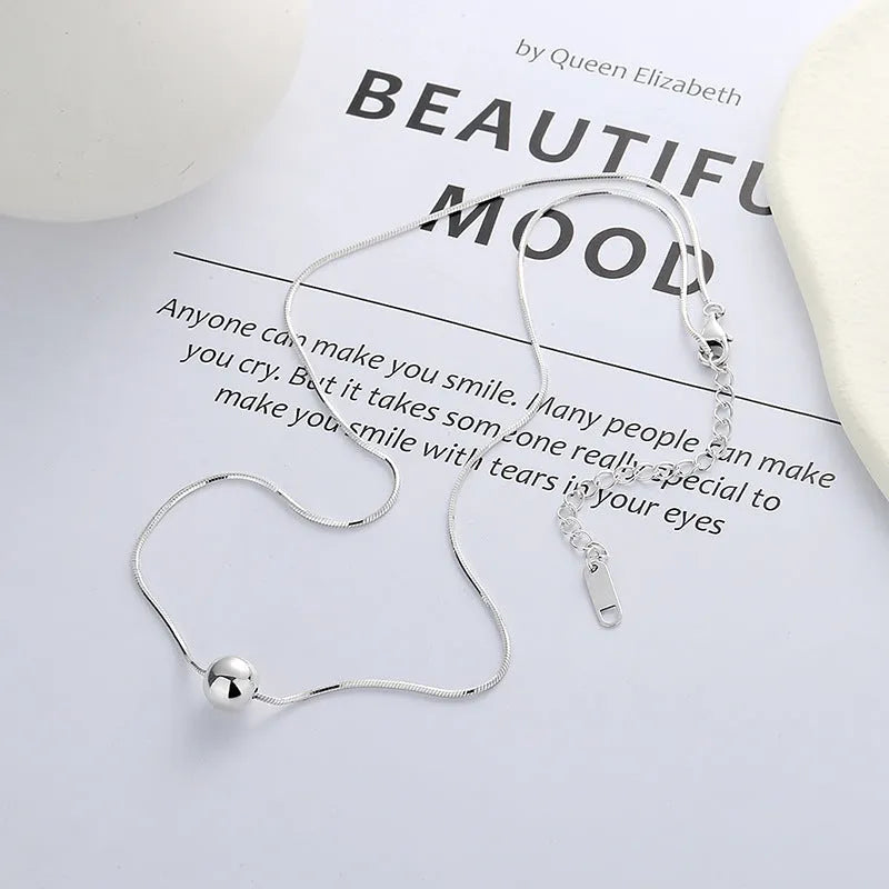 Sterling silver clavicle chain necklace with small ball pendant on delicate chain