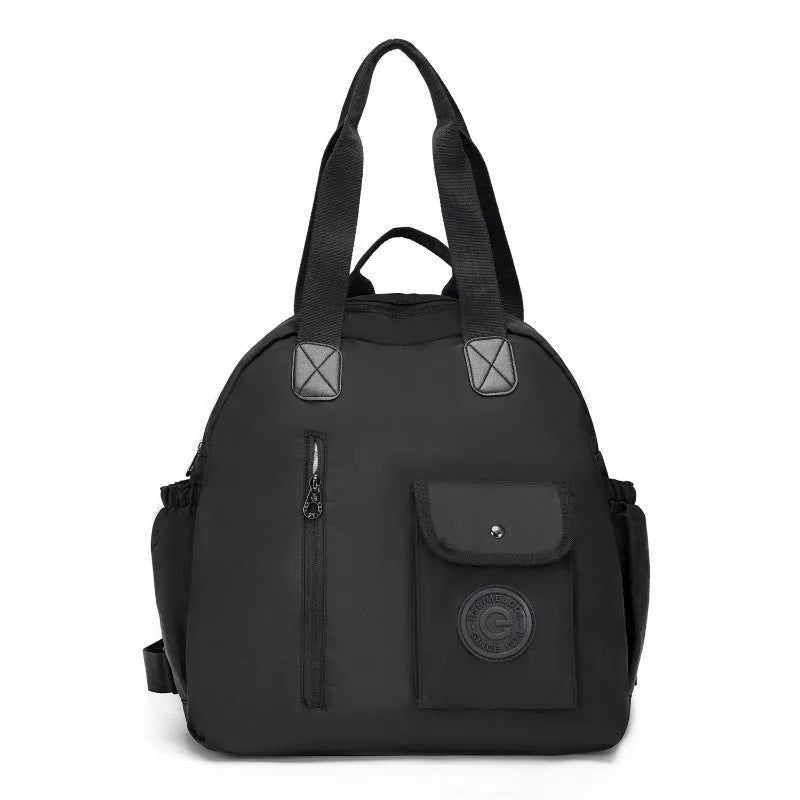 Outdoor lightweight large capacity nylon backpack in black, shown with sandwich pocket detail.