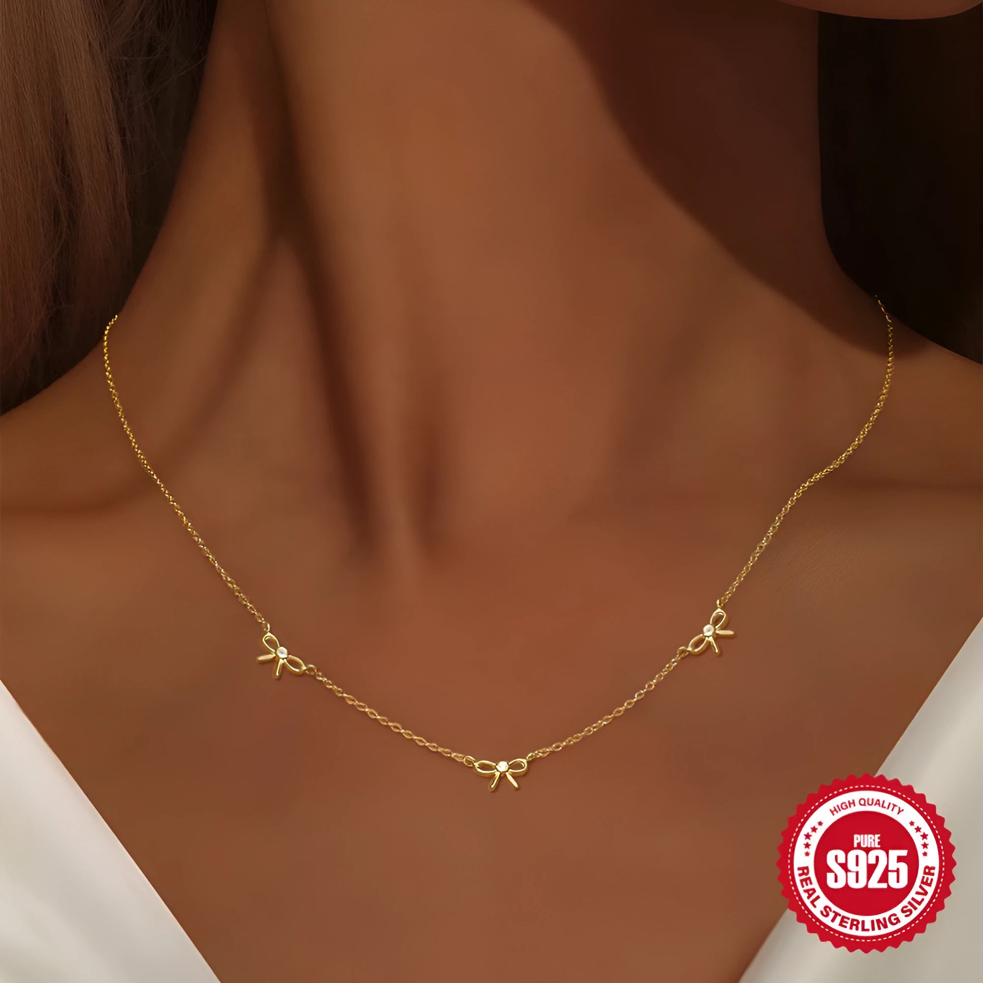 S925 sterling silver bow pendant ear bone stud bracelet necklace jewellery set with gold electroplated finish on O-shaped chain