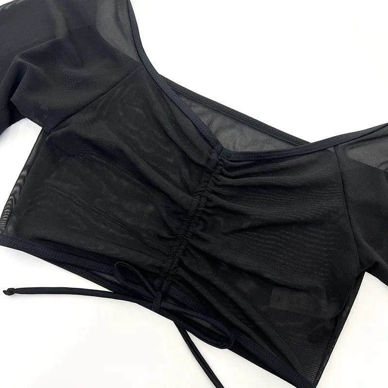 Black mesh women's four-piece bikini set with long sleeves for swimming