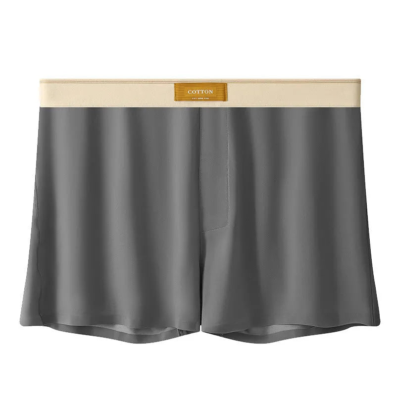 Three pairs of solid colour men's loose fit ice silk boxers laid flat, showing beige apricot, black, and dark grey.