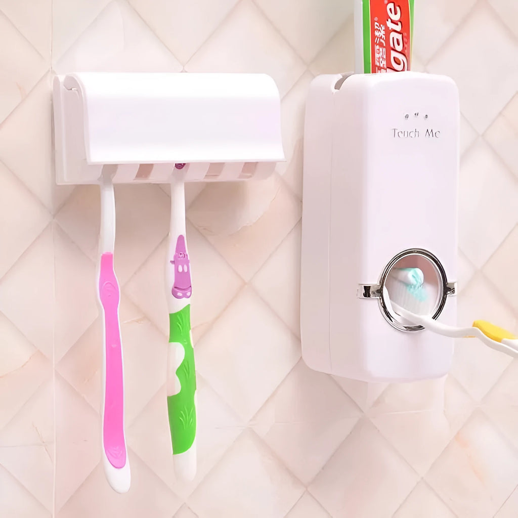 White adhesive wall-mounted toothbrush holder with pump on a bathroom tile.