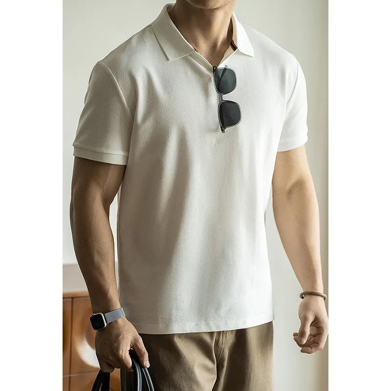 American-style short-sleeved polo shirt in blue on hanger showing regular fit and cotton blend fabric.