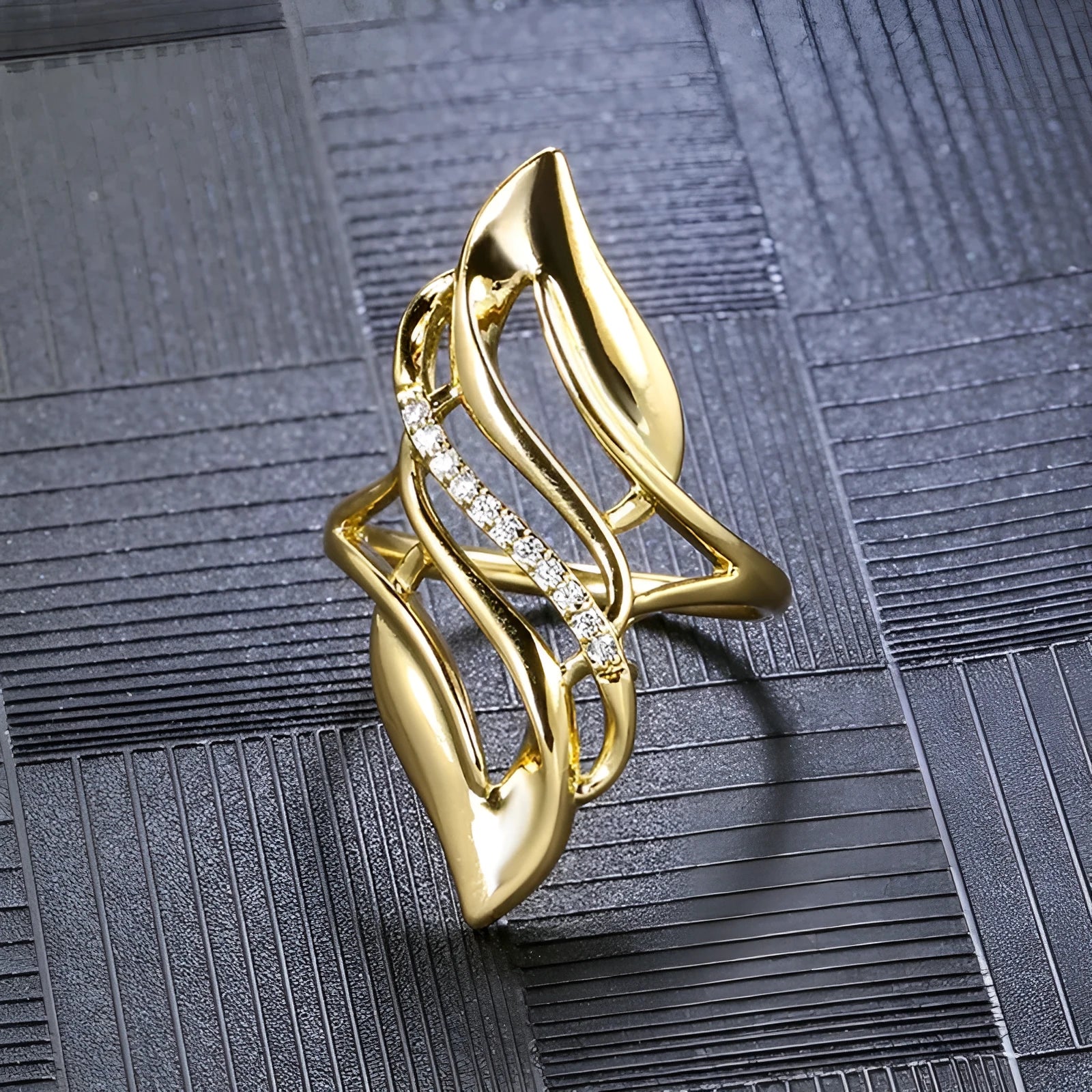 Gold-coloured copper women's ring with exaggerated curve design on finger