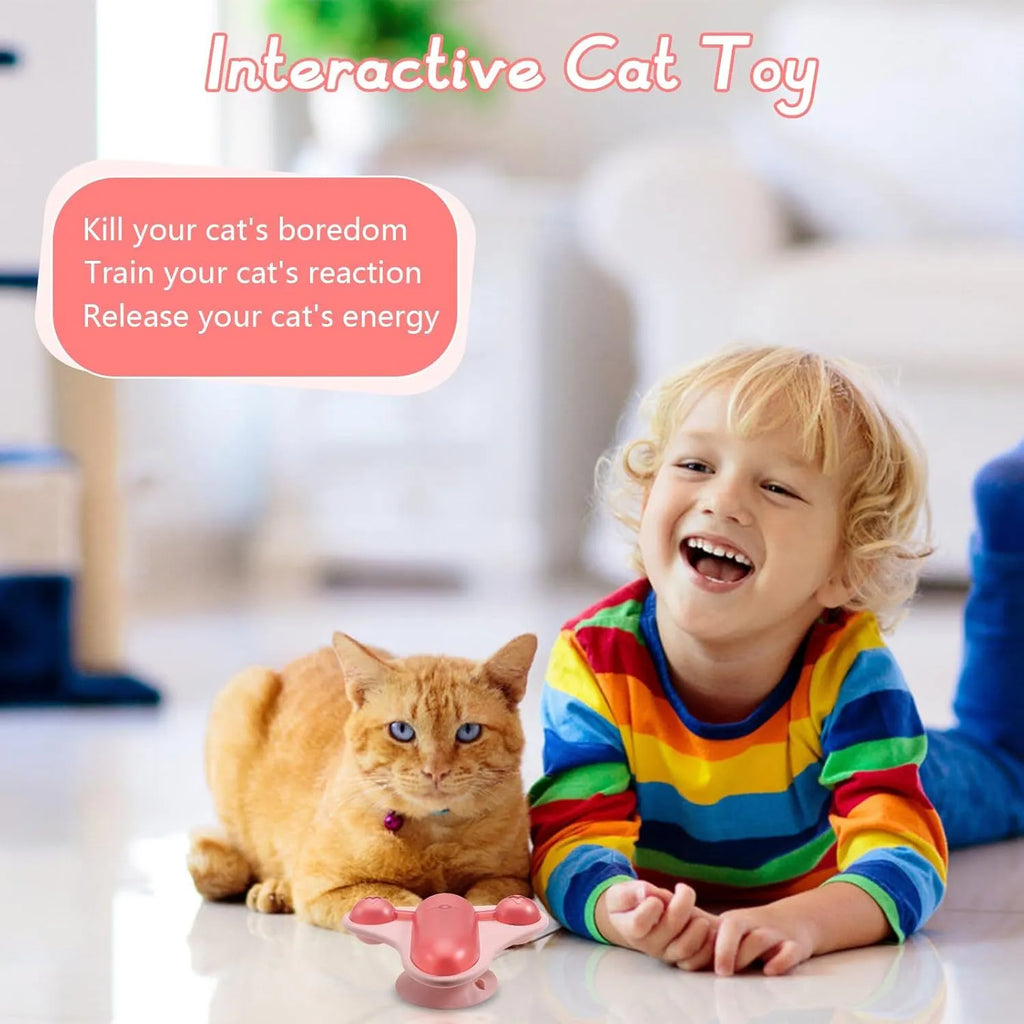 Blue interactive pet puzzle toy with bell, catnip holder, and snack dispenser on a smooth floor.