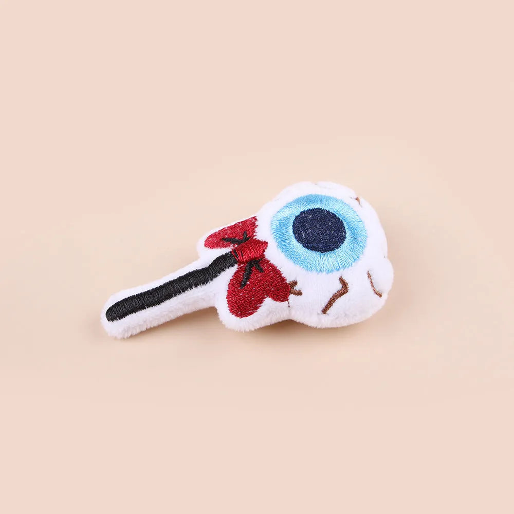Plush cat teaser toy with feather wand in candy or skull design for small cats
