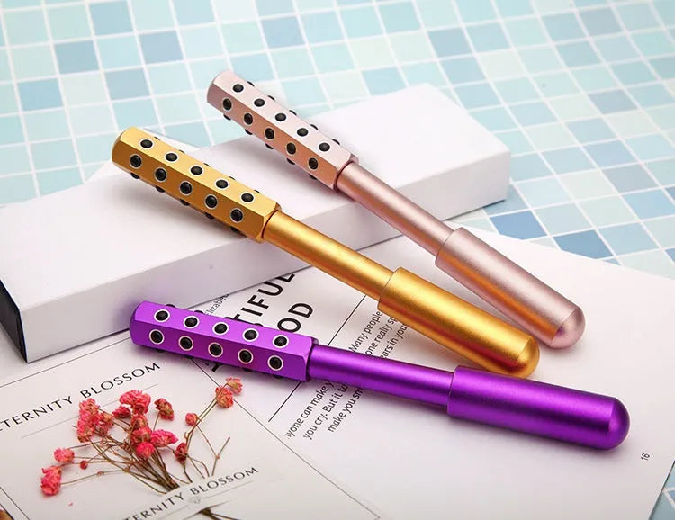 Purple germanium particle facial massage roller approximately 193mm long